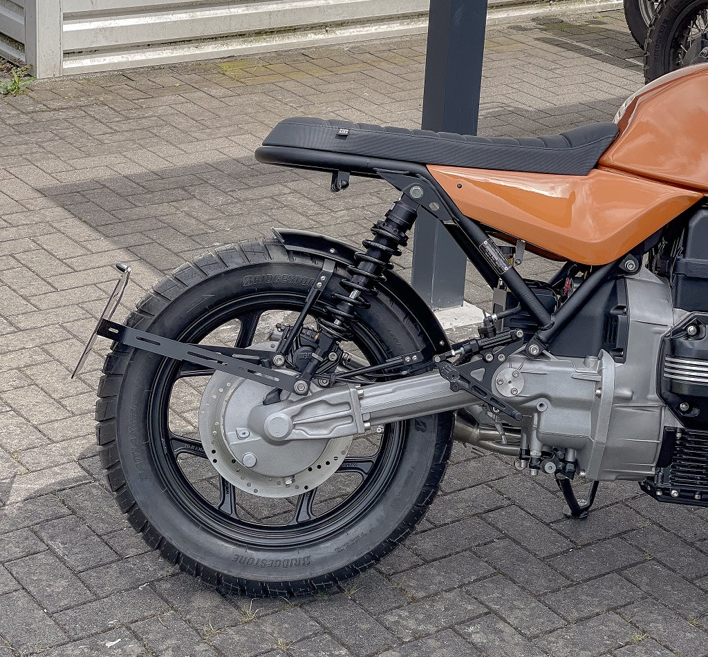 Rear view of the BMW K-Project custom bike by SE, featuring exclusive SE BMW K-model accessories on the bike and seat.