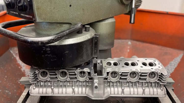 Face milling the cylinder head sealing surface on a surface milling machine for a 3-cylinder engine